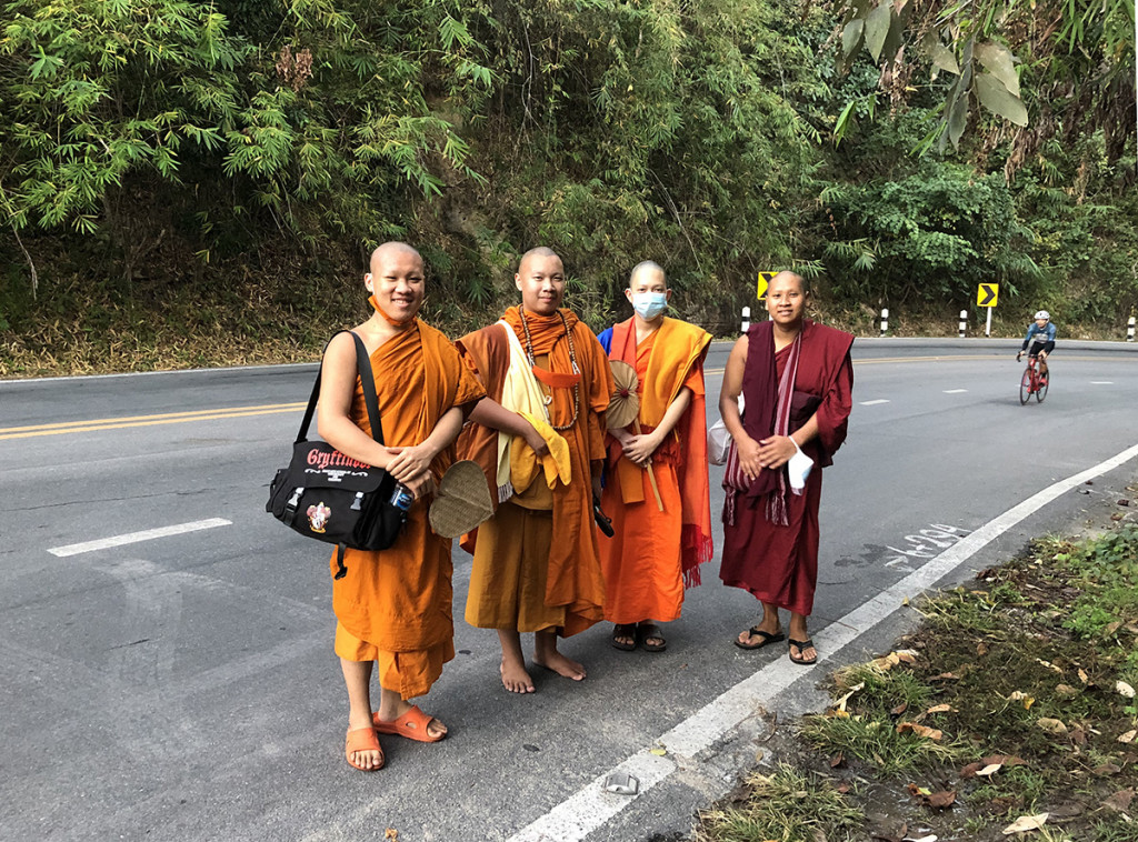 Cheerful monks walking up the hill. I think they were heading to one of the waterfalls. One of them is going barefoot -- I could never do that!