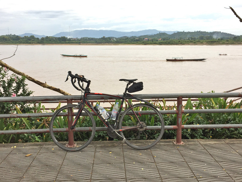 Riding along the Mekong near the Golden Triangle. Laos is across the water.