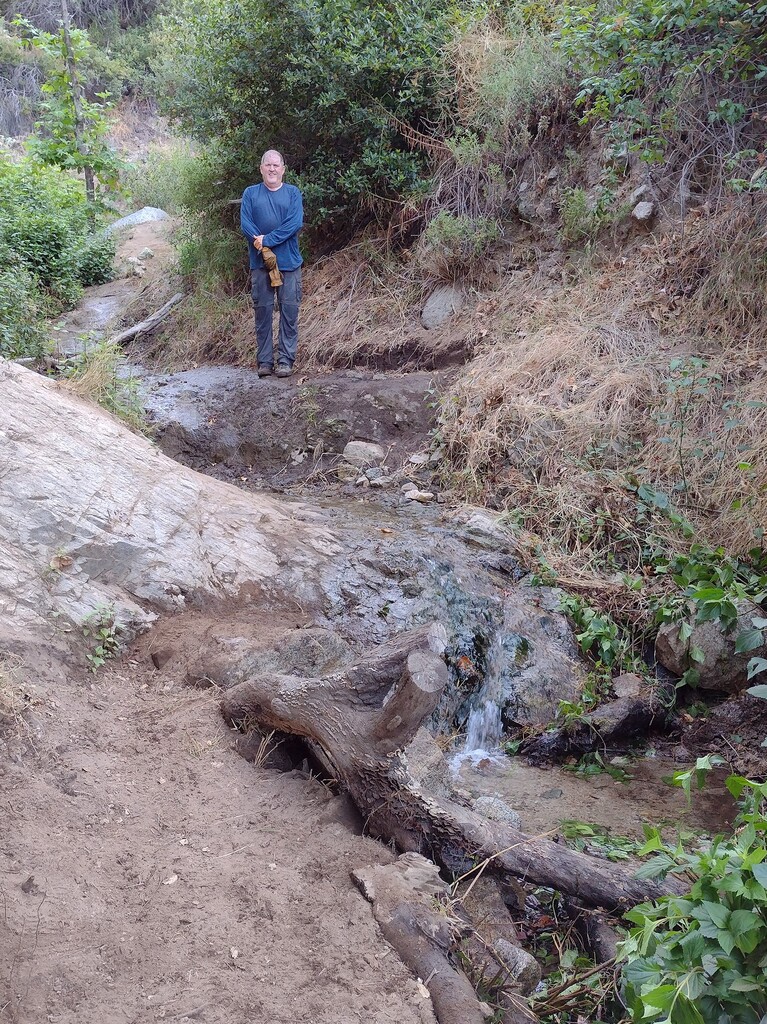 After moving boulder into place, creating a step and new tread at the cascade.