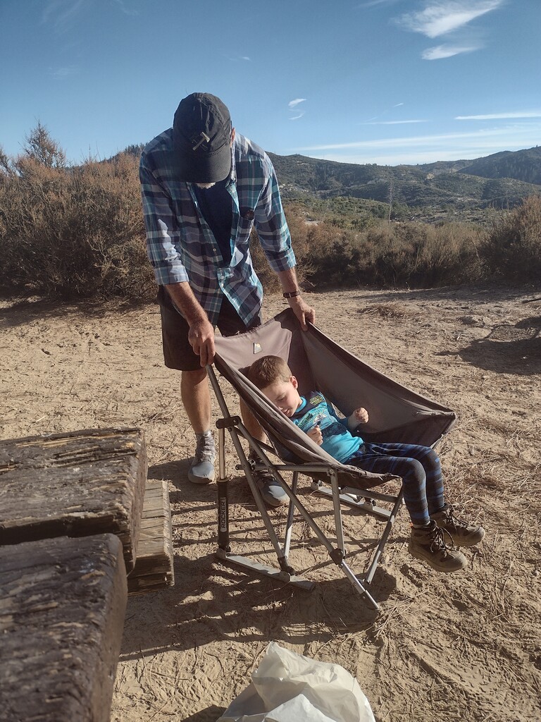 Jeff &amp; Forest enjoy the rocking chair.