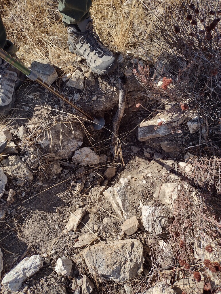 The hole in the ground where the monument once resided.