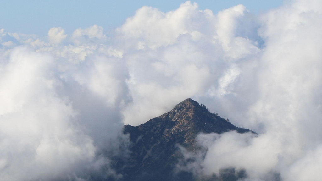 454 Rattlesnake Peak shrouded in puffy clouds.jpg