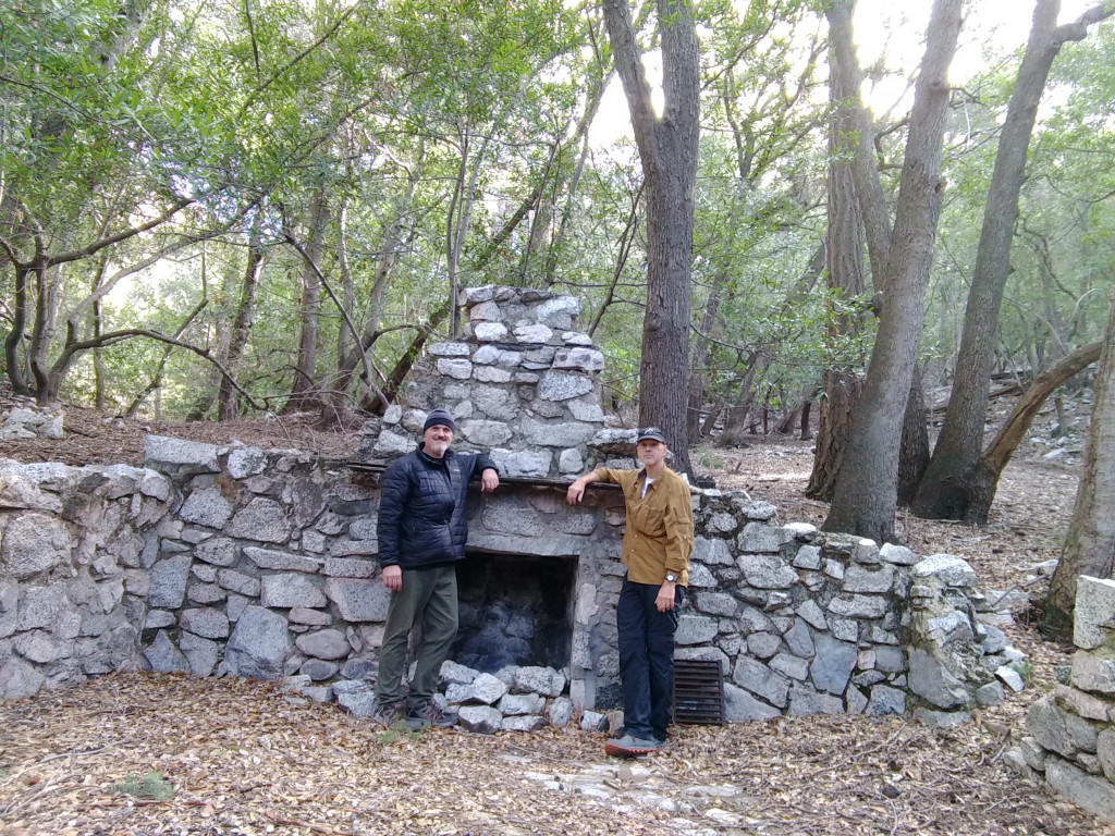 Two dudes chillin at Grand Cyn cabin ruins.